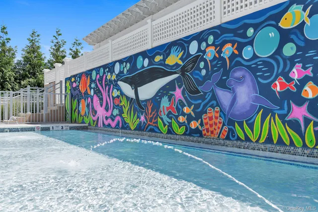 a view of a wooden house with a small yard and wooden fence