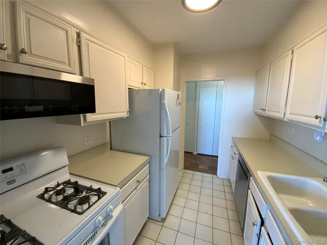 a kitchen with a stove and a refrigerator
