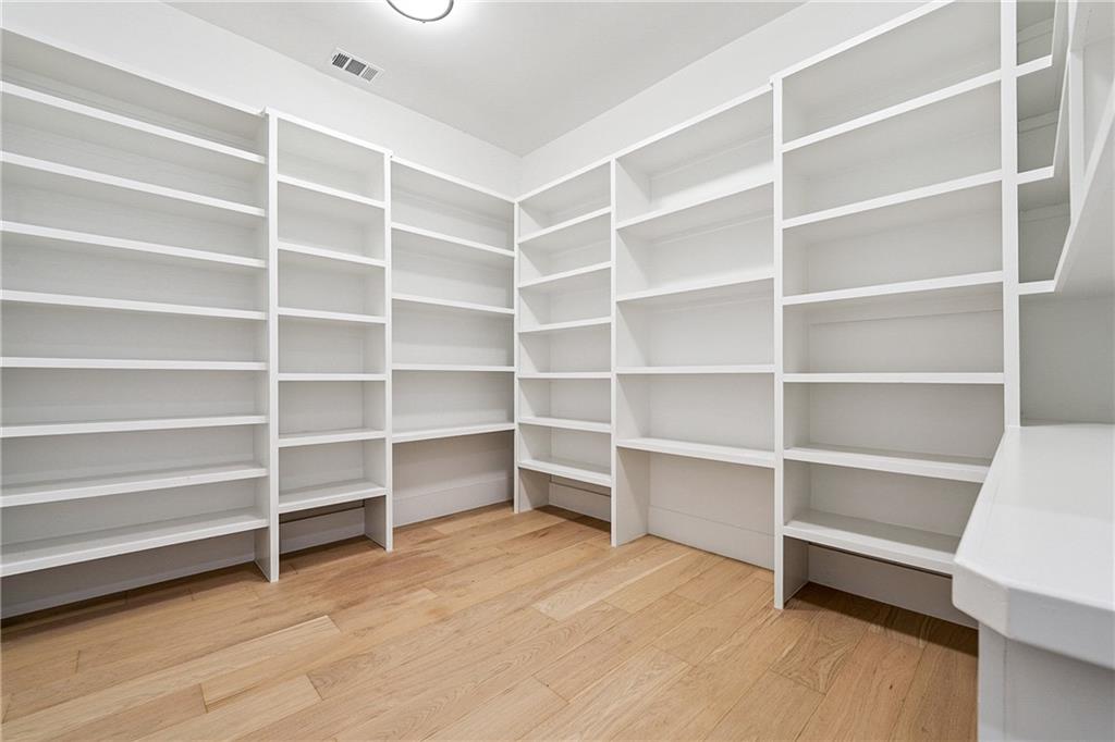 2551 Kilgore Road Buford, GA 30519 - Photo 12 of 45 a view of walk in closet with empty racks