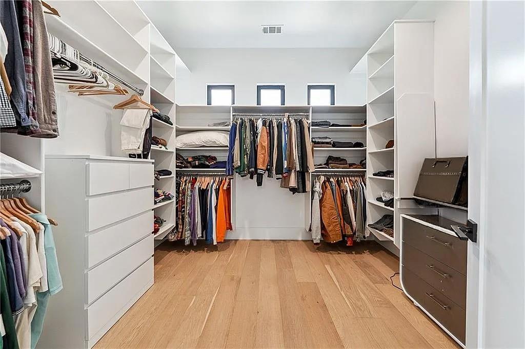 2551 Kilgore Road Buford, GA 30519 - Photo 18 of 45 a view of walk in closet with clothes and shoes