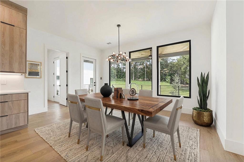 2551 Kilgore Road Buford, GA 30519 - Photo 19 of 45 a view of a dining room with furniture window and wooden floor