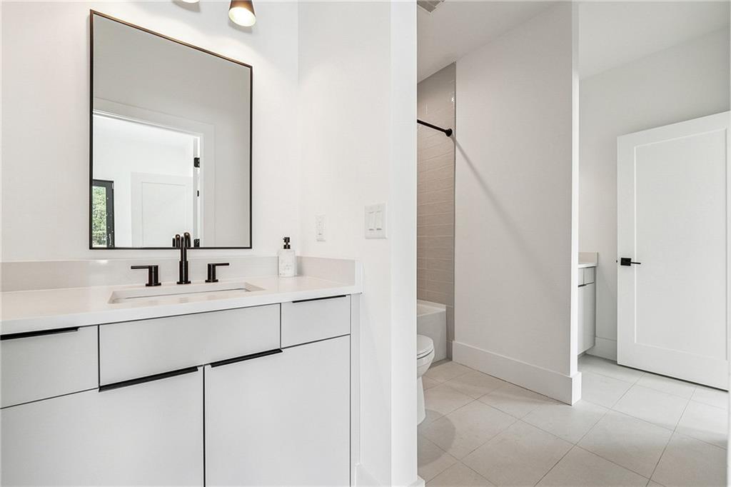 2551 Kilgore Road Buford, GA 30519 - Photo 29 of 45 a bathroom with a sink and a mirror