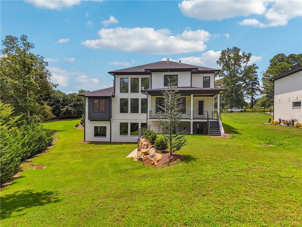 2551 Kilgore Road Buford, GA 30519 - Photo 3 of 45 a house with garden in front of it