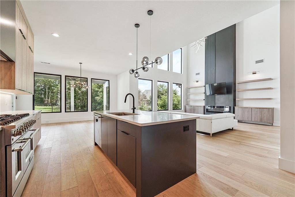 2551 Kilgore Road Buford, GA 30519 - Photo 9 of 45 a kitchen with stainless steel appliances granite countertop a stove and a sink