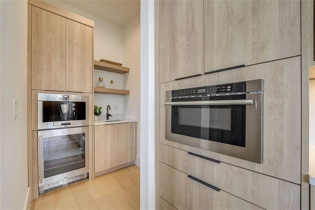 2551 Kilgore Road Buford, GA 30519 - Photo 10 of 45 a kitchen with stainless steel appliances a stove a microwave and a refrigerator