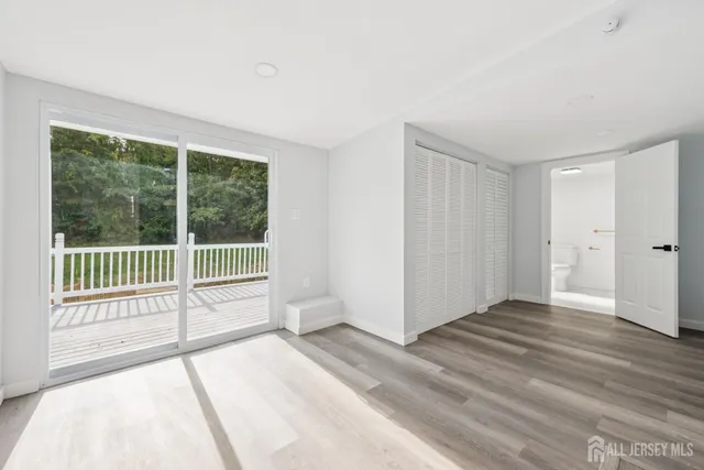 a bathroom with a sink a mirror and a shower