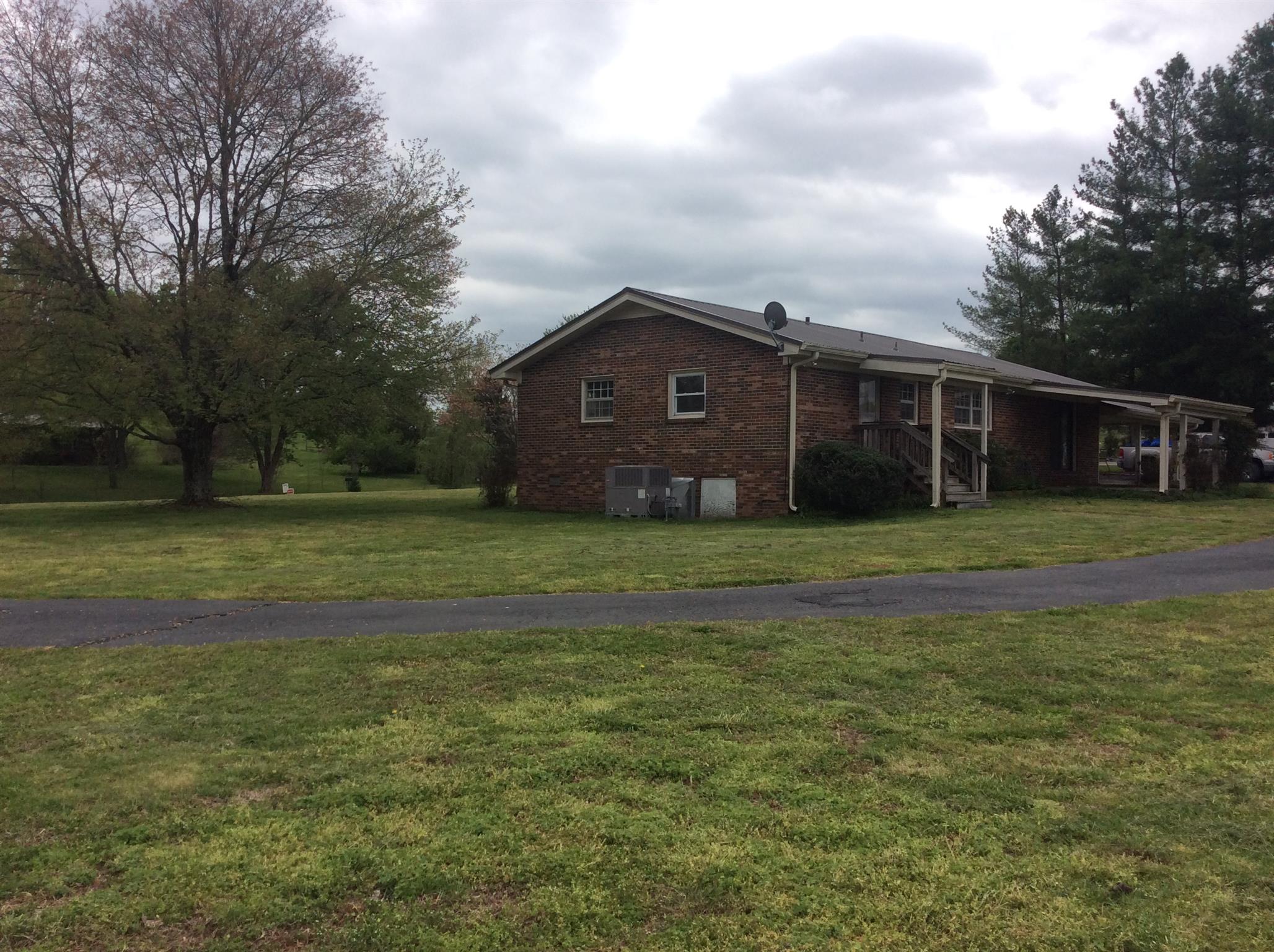 808 Cheatham Springs Road Eagleville, TN 37060 - Photo 5 of 24 Rear of home with circle drive.