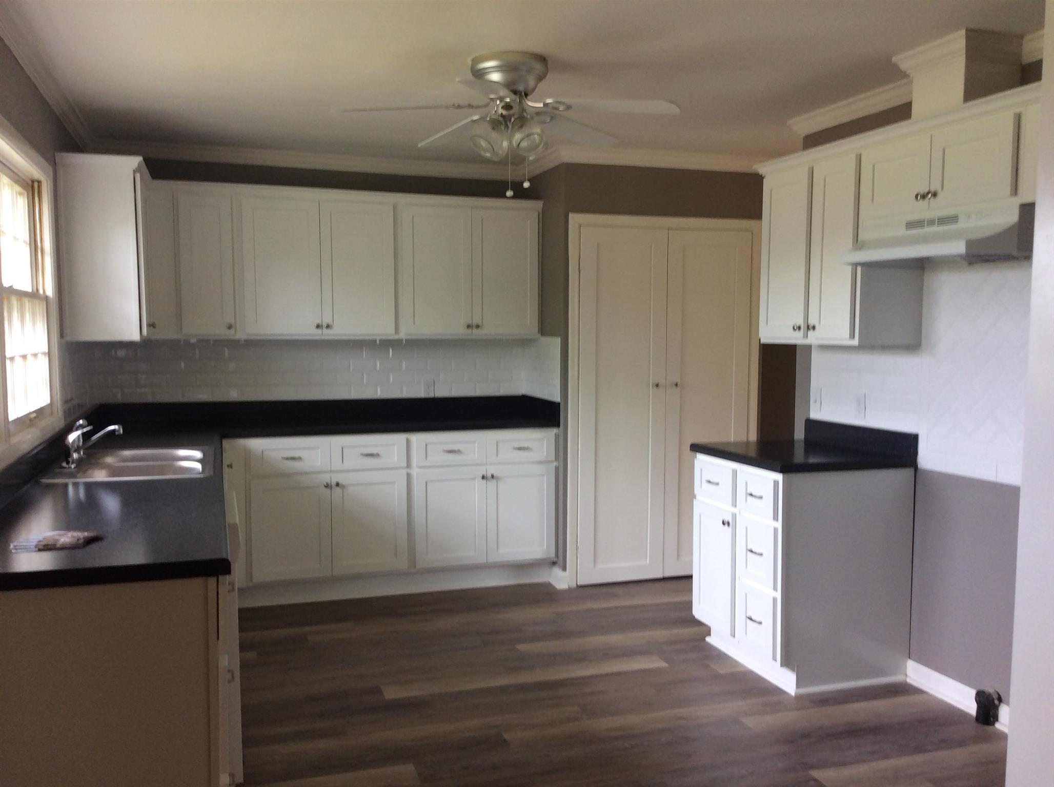 808 Cheatham Springs Road Eagleville, TN 37060 - Photo 8 of 24 All new kitchen. New cabinets, tile backsplash, oountertops and flooring.