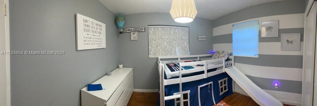 Kendale Lakes Miami, FL 33183 - Photo 15 of 17 a bathroom with a bathtub sink vanity and mirror