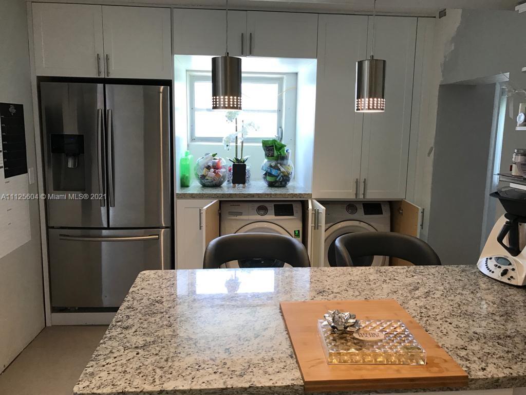 Kendale Lakes Miami, FL 33183 - Photo 3 of 17 a kitchen with a refrigerator and a sink