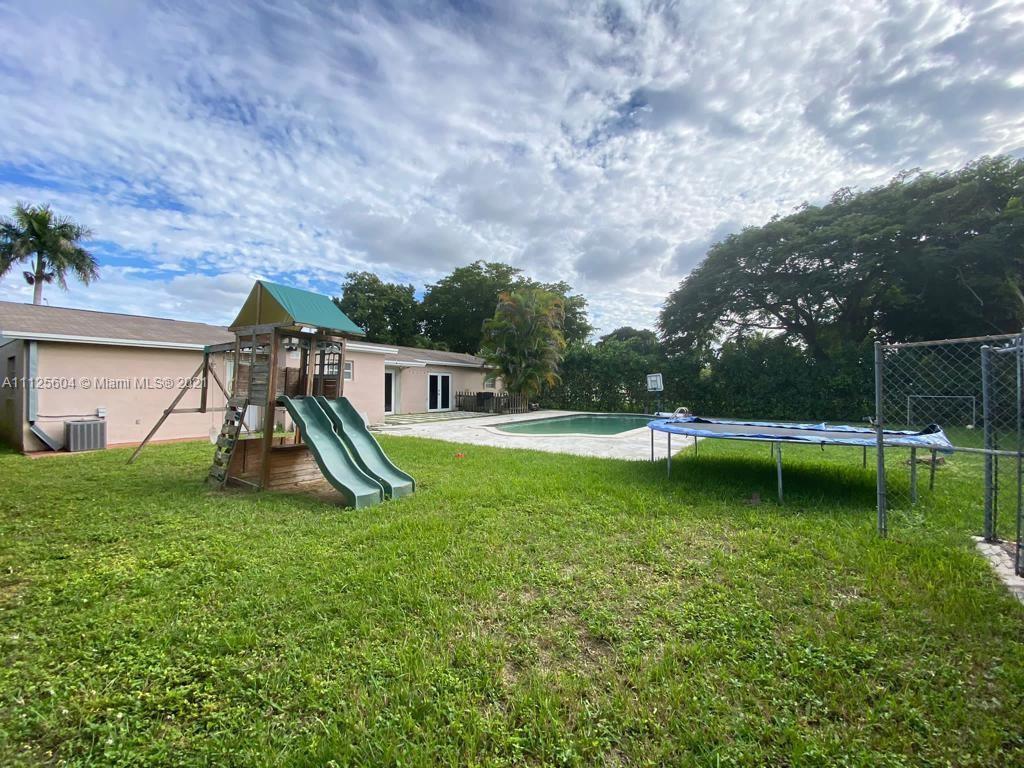 Kendale Lakes Miami, FL 33183 - Photo 6 of 17 a view of a garden with swimming pool