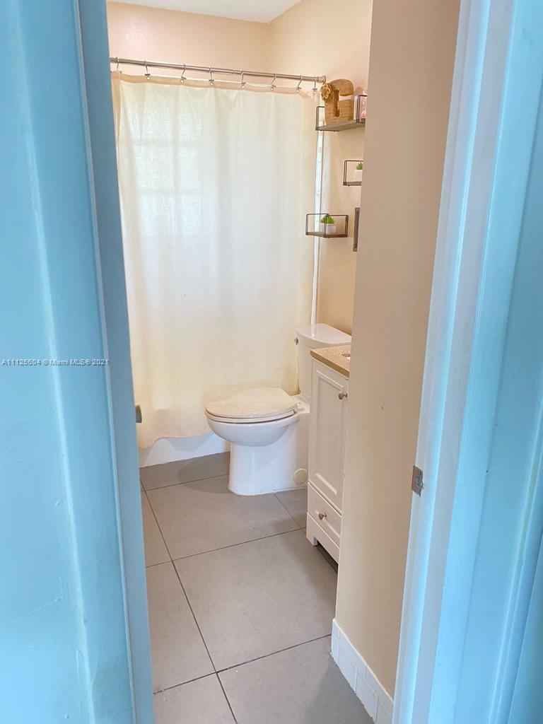 Kendale Lakes Miami, FL 33183 - Photo 8 of 17 a bathroom with a toilet and a shower