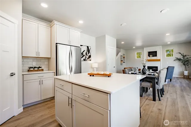 a kitchen with a white cabinets and a stove