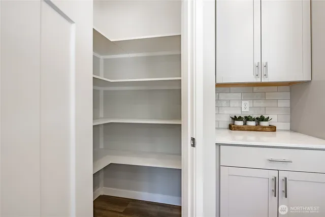 a view of a living room and a large window