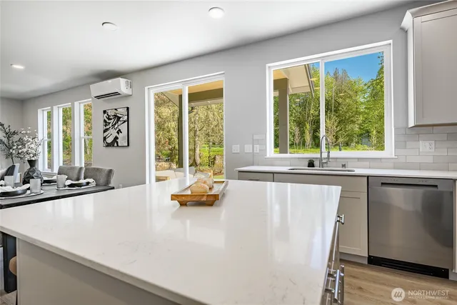 a spacious bedroom with a bed and a window