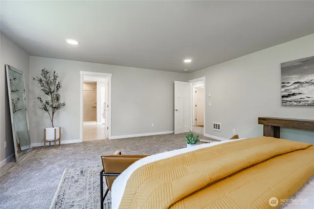 a bathroom with a double vanity sink mirror and shower
