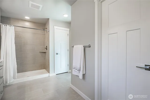 a en suite bathroom with a sink and mirror