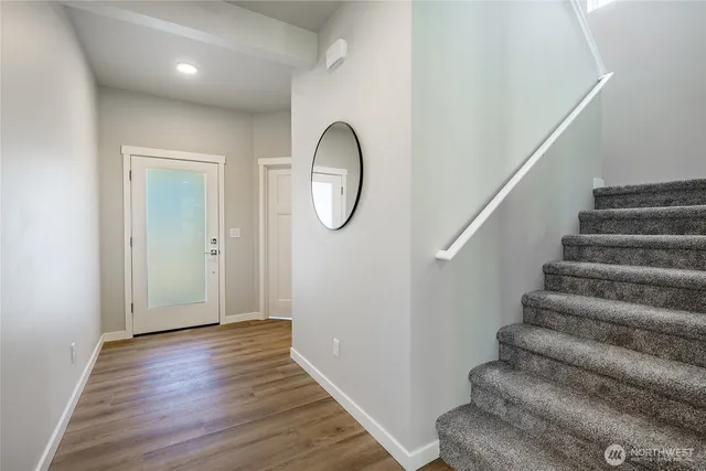 a view of living room and wooden floor