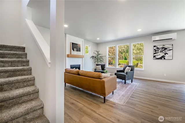 a living room with furniture and a large window