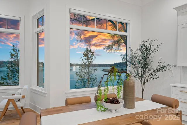 a bedroom with a large bed and a potted plant