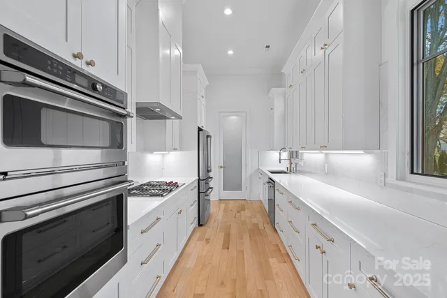 a spacious bedroom with a large bed and a couch