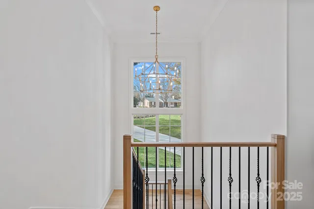 a bed room with a bed and a chair