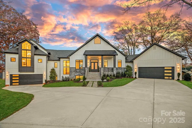 a living room with furniture wooden floor and a large window