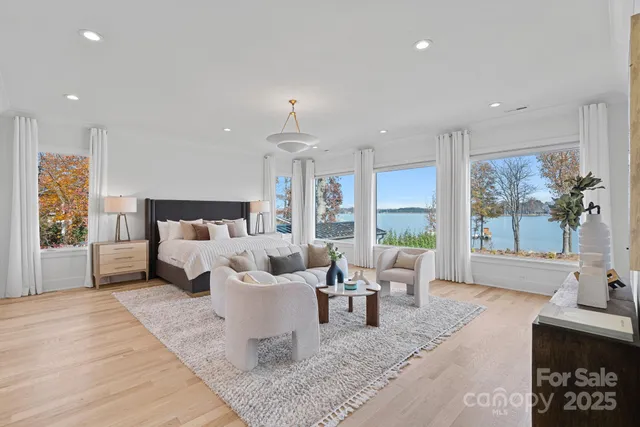 a bathroom with a granite countertop sink a toilet and mirror