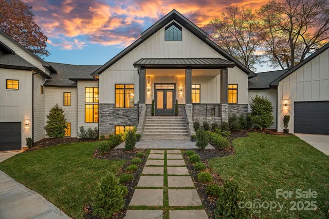 a living room with furniture and view of kitchen