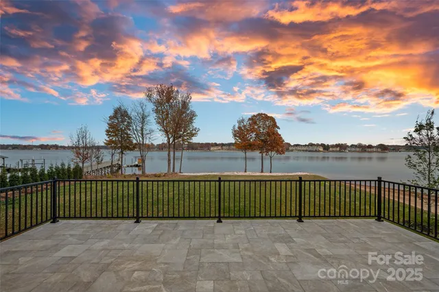 a bathroom with a bathtub and potted plant