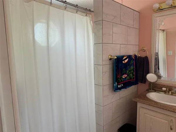 a bathroom with a toilet a sink and a window
