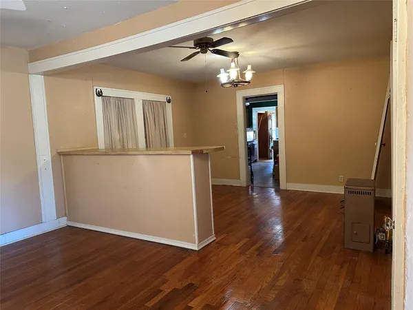 a kitchen with a stove microwave and sink