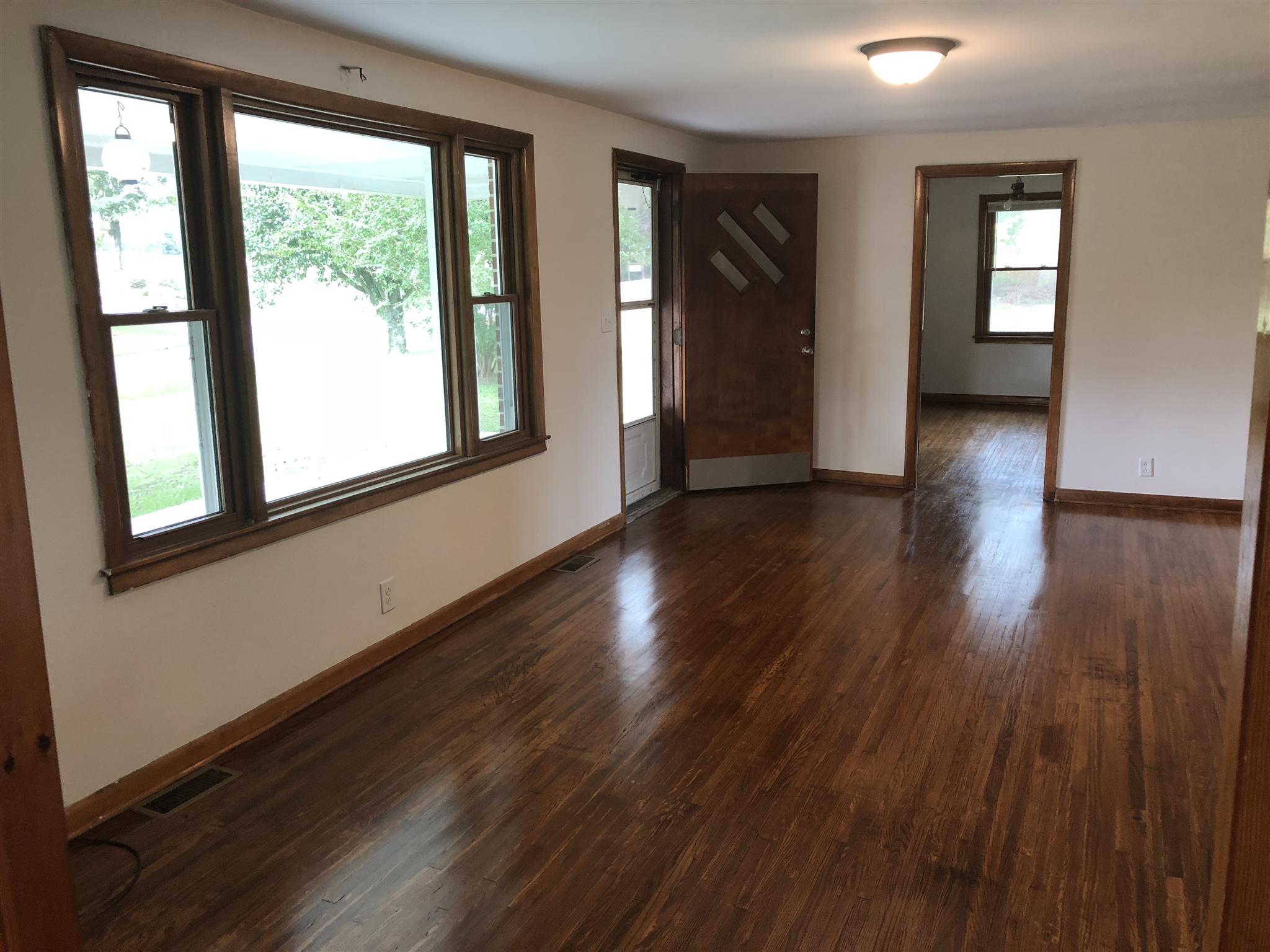 3107 Pea Ridge Road Liberty, TN 37095 - Photo 4 of 13 a view of an empty room with wooden floor and a window