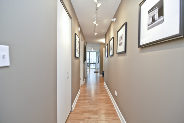 2 East Erie Street, Unit 1611 Chicago, IL 60611 - Photo 11 of 12 a view of a hallway with a white walls