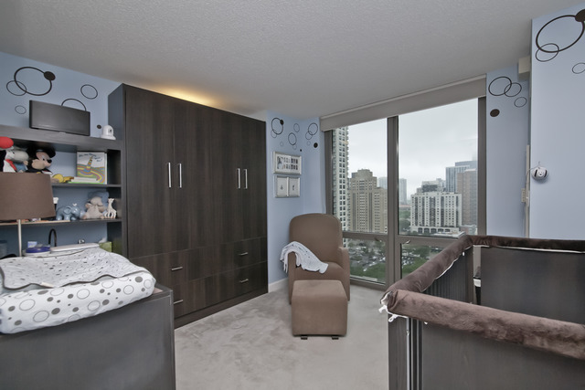 2 East Erie Street, Unit 1611 Chicago, IL 60611 - Photo 10 of 12 a room with furniture and a window