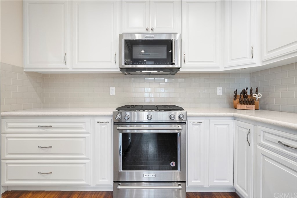 5965 Maybrook Circle Riverside, CA 92506 - Photo 15 of 34 a stove top oven sitting inside of a kitchen