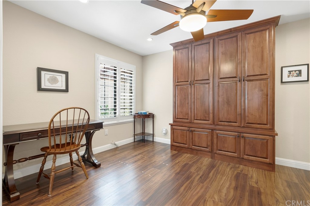 5965 Maybrook Circle Riverside, CA 92506 - Photo 18 of 34 a living room with wooden floor and furniture