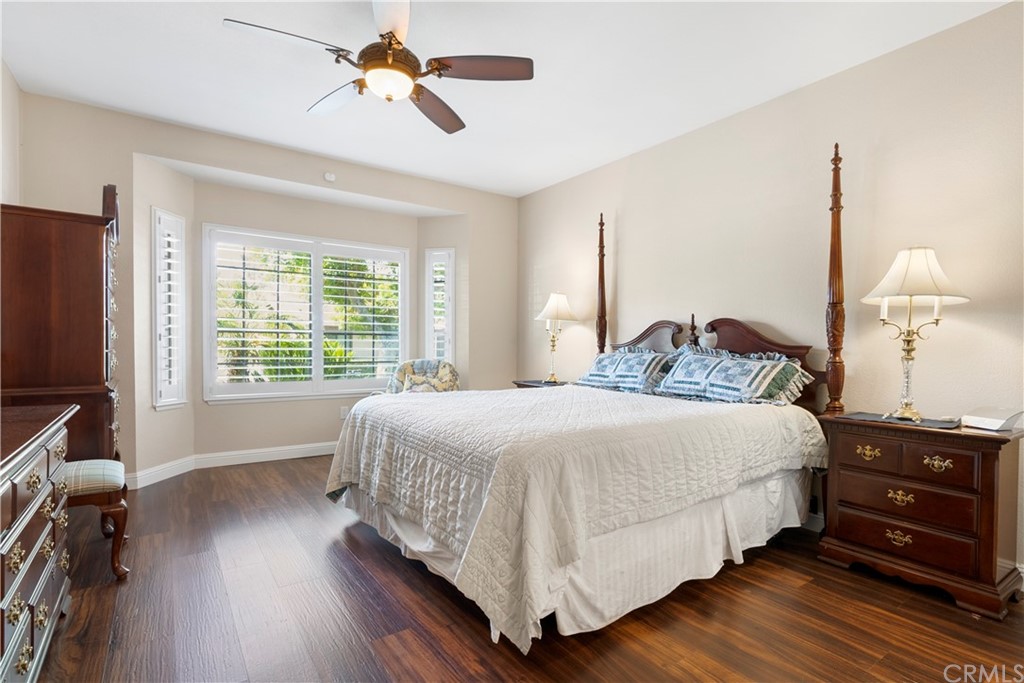5965 Maybrook Circle Riverside, CA 92506 - Photo 24 of 34 a bedroom with a bed dresser and a window