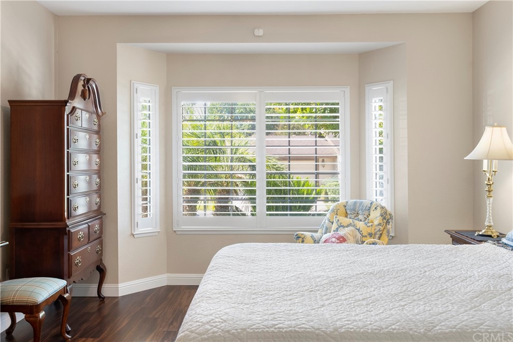 5965 Maybrook Circle Riverside, CA 92506 - Photo 25 of 34 a bed sitting in a bedroom next to a window
