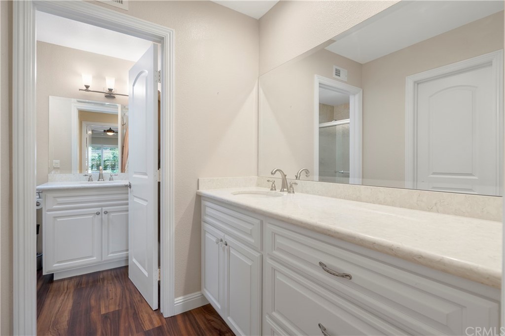 5965 Maybrook Circle Riverside, CA 92506 - Photo 27 of 34 a bathroom with a sink and a mirror