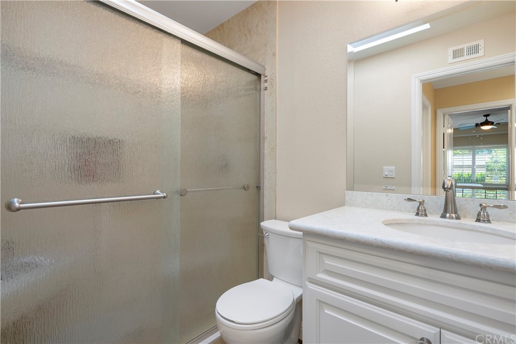 5965 Maybrook Circle Riverside, CA 92506 - Photo 28 of 34 a bathroom with a sink a toilet and shower