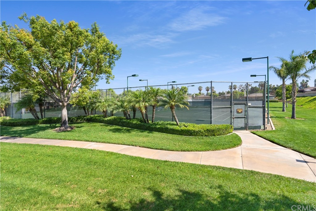 5965 Maybrook Circle Riverside, CA 92506 - Photo 31 of 34 a view of a garden with a building in the background