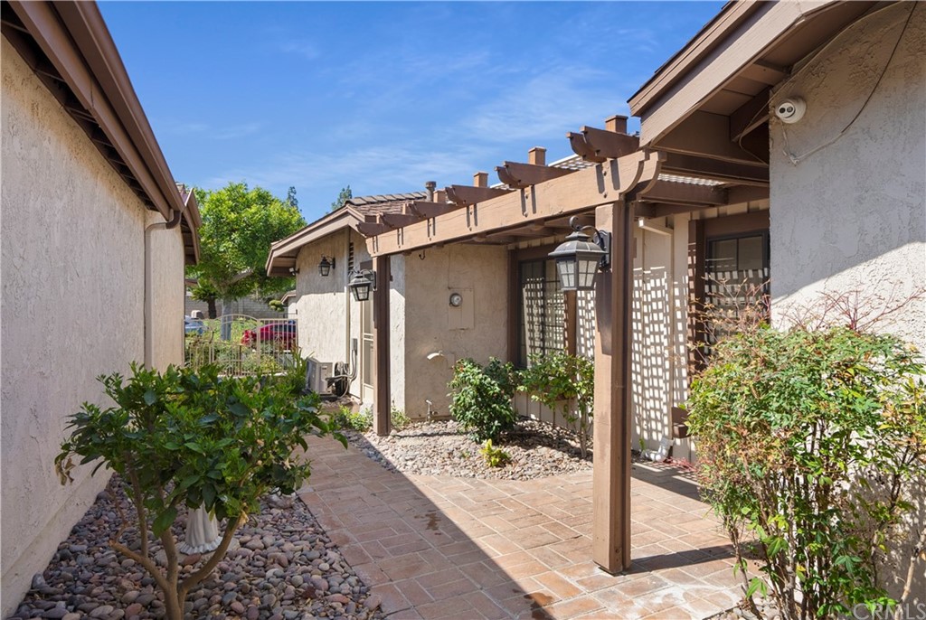 5965 Maybrook Circle Riverside, CA 92506 - Photo 5 of 34 a front view of a house with garden