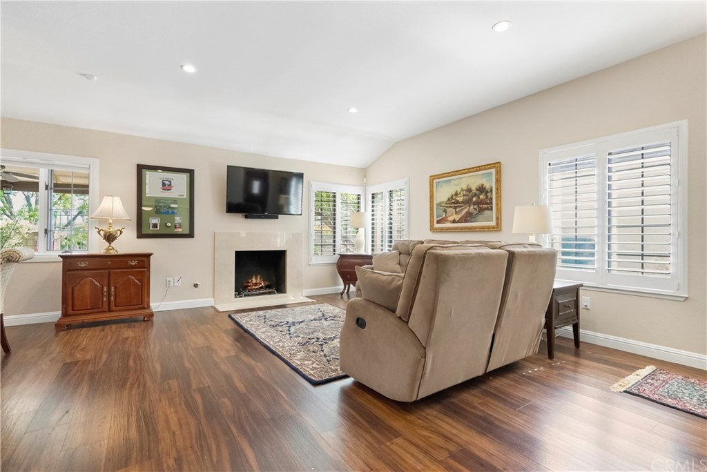 5965 Maybrook Circle Riverside, CA 92506 - Photo 8 of 34 a living room with furniture fireplace and flat screen tv