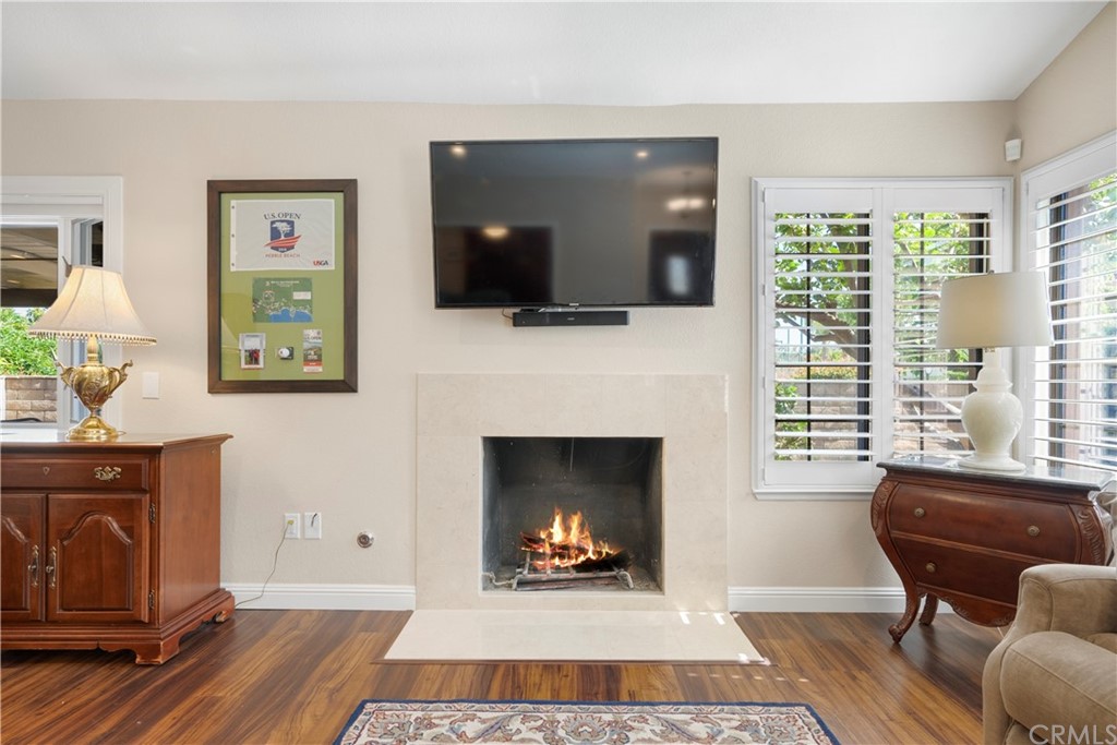 5965 Maybrook Circle Riverside, CA 92506 - Photo 10 of 34 a living room with furniture and a fireplace