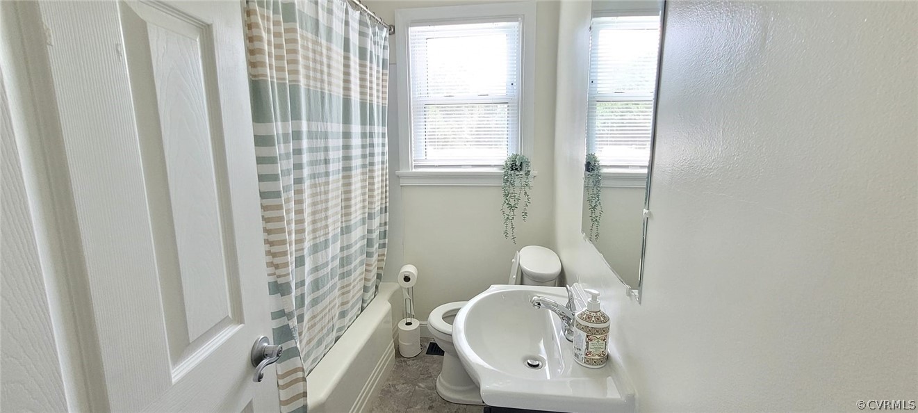 10617 Reams Road Chesterfield, VA 23236 - Photo 19 of 34 a bathroom with a toilet a sink and shower curtain