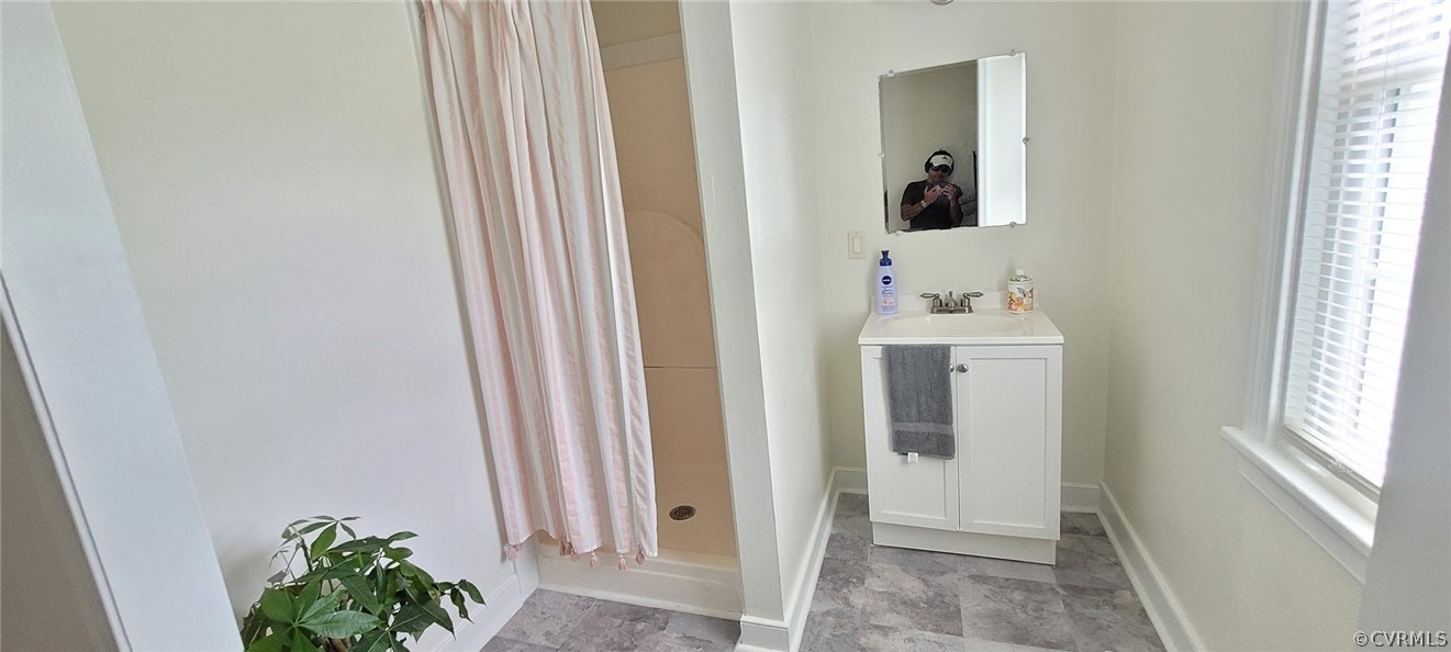 10617 Reams Road Chesterfield, VA 23236 - Photo 28 of 34 a bathroom with a sink and a mirror