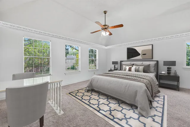 a view of a livingroom with a ceiling fan and window