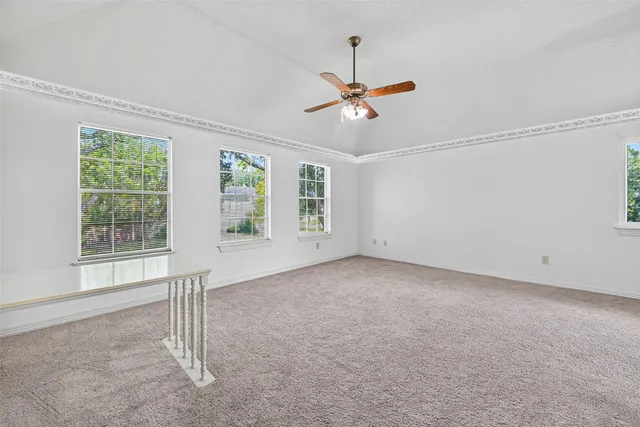 a spacious bathroom with a bathtub a sink and a window