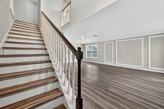 a view of an entryway with wooden floor